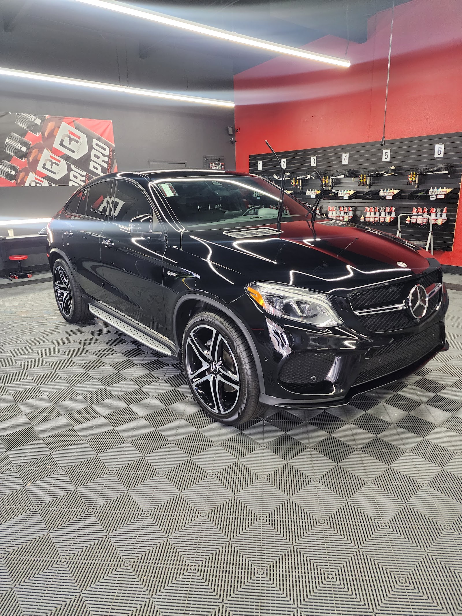 Black Mercedes GLE Coupe detailed inside a ceramic coating studio